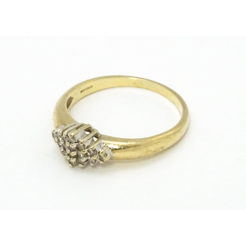 708 - A 9ct gold ring set with diamond cluster. Ring size approx. K 1/2