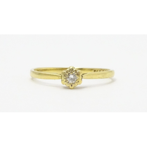 722 - An 18ct gold diamond solitaire ring. Ring size approx. p 1/2