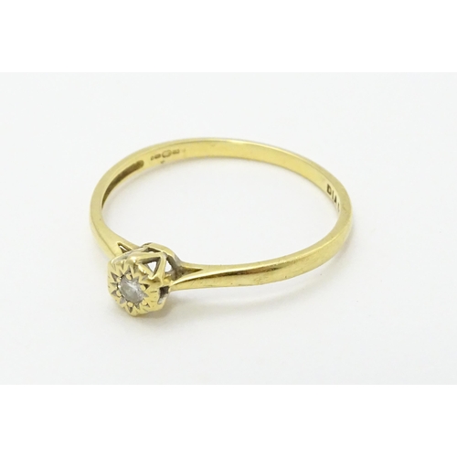 722 - An 18ct gold diamond solitaire ring. Ring size approx. p 1/2