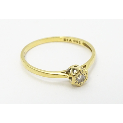 722 - An 18ct gold diamond solitaire ring. Ring size approx. p 1/2