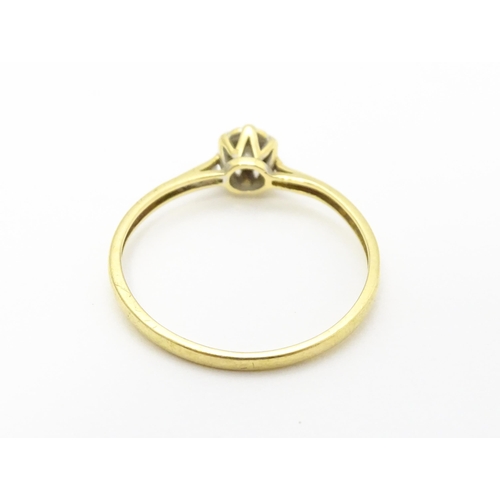 722 - An 18ct gold diamond solitaire ring. Ring size approx. p 1/2