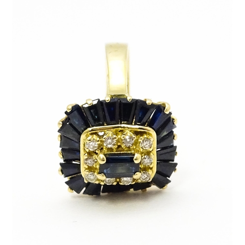 726 - A yellow metal cocktail ring set with central sapphire blue coloured stone bordered by diamonds and ... 