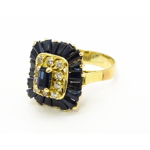 726 - A yellow metal cocktail ring set with central sapphire blue coloured stone bordered by diamonds and ... 