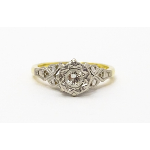 727 - An 18ct gold ring set with diamond solitaire. Ring size approx. I 1/2