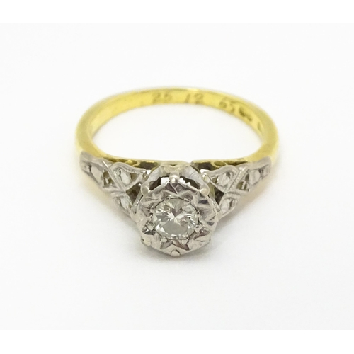 727 - An 18ct gold ring set with diamond solitaire. Ring size approx. I 1/2