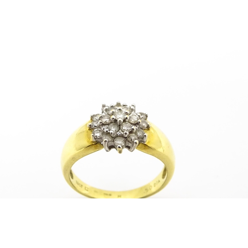 729 - An 18ct gold ring  set with diamond cluster. Ring size approx. L.