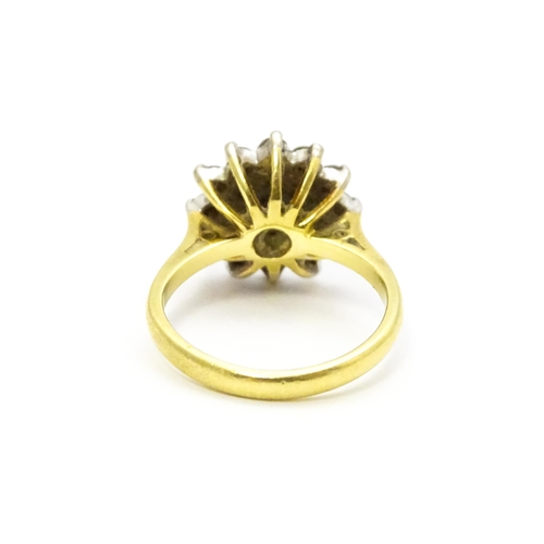 732 - An 18ct gold ring set with diamond cluster. Ring size approx. J