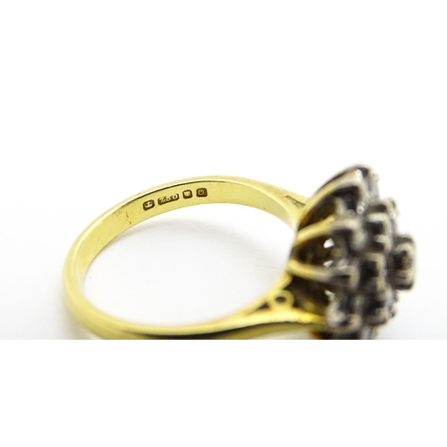 732 - An 18ct gold ring set with diamond cluster. Ring size approx. J