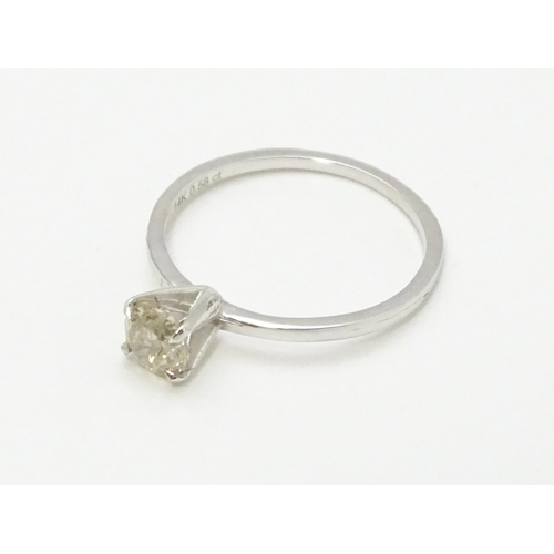 735 - A 14ct white gold ring set with diamond solitaire. Ring size approx. M 1/2