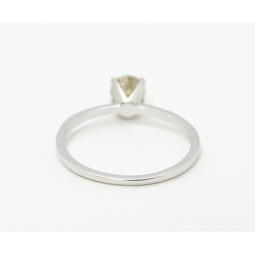 735 - A 14ct white gold ring set with diamond solitaire. Ring size approx. M 1/2