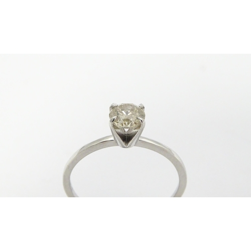 735 - A 14ct white gold ring set with diamond solitaire. Ring size approx. M 1/2