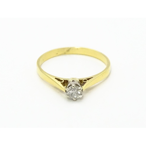 742 - An 18ct gold diamond solitaire ring. Ring size approx.  M