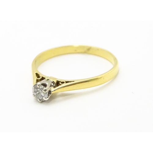 742 - An 18ct gold diamond solitaire ring. Ring size approx.  M