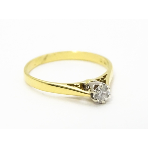 742 - An 18ct gold diamond solitaire ring. Ring size approx.  M