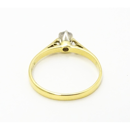 742 - An 18ct gold diamond solitaire ring. Ring size approx.  M