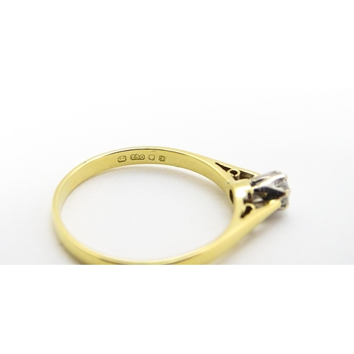 742 - An 18ct gold diamond solitaire ring. Ring size approx.  M