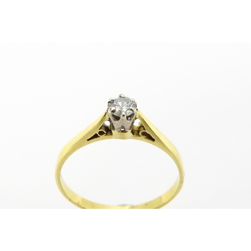 742 - An 18ct gold diamond solitaire ring. Ring size approx.  M