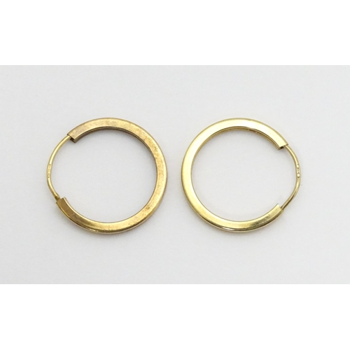 748 - A pair of 9ct gold hoop earrings. Approx. 3/4