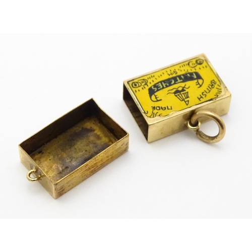 750 - A 9ct gold novelty charm / pendant modelled as a box of British made matches. Approx. 3/4