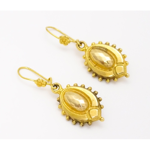 751 - A pair of Victorian 9ct gold and yellow metal drop earrings. Approx. 1 1/4