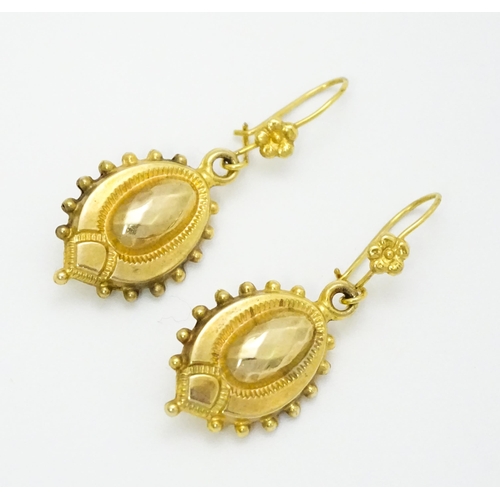 751 - A pair of Victorian 9ct gold and yellow metal drop earrings. Approx. 1 1/4