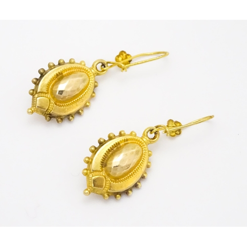 751 - A pair of Victorian 9ct gold and yellow metal drop earrings. Approx. 1 1/4