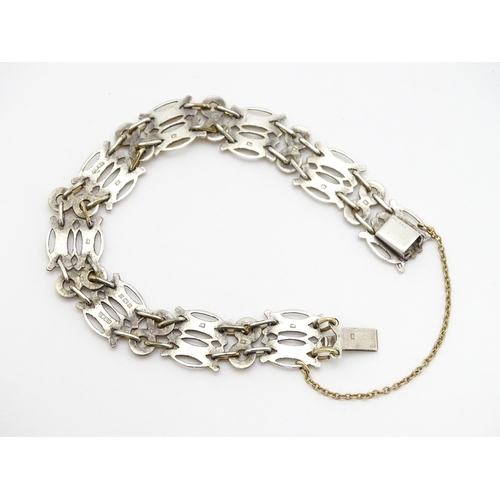 755 - An Elizabeth II silver bracelet with gilt detail hallmarked Birmingham 1952, maker Herbert Bushell &... 