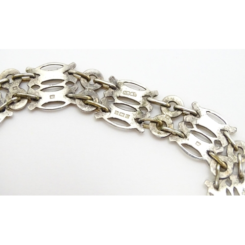 755 - An Elizabeth II silver bracelet with gilt detail hallmarked Birmingham 1952, maker Herbert Bushell &... 