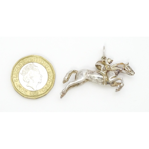 756 - A silver pendant modelled as a racehorse and jockey hallmarked London 1983, maker HG. Approx. 1 1/2