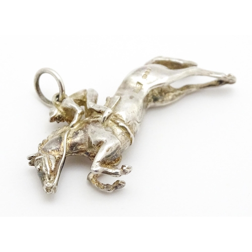 756 - A silver pendant modelled as a racehorse and jockey hallmarked London 1983, maker HG. Approx. 1 1/2