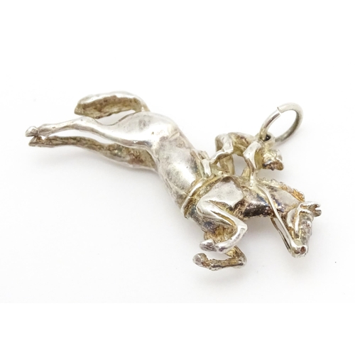 756 - A silver pendant modelled as a racehorse and jockey hallmarked London 1983, maker HG. Approx. 1 1/2