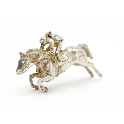 756 - A silver pendant modelled as a racehorse and jockey hallmarked London 1983, maker HG. Approx. 1 1/2