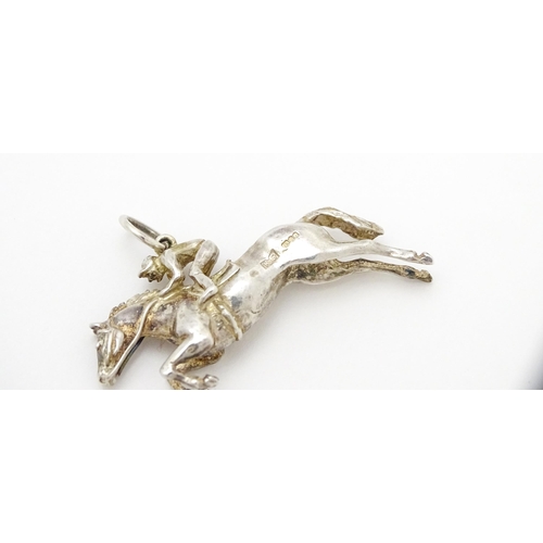 756 - A silver pendant modelled as a racehorse and jockey hallmarked London 1983, maker HG. Approx. 1 1/2