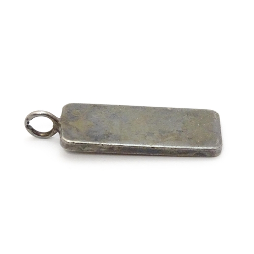 759 - A silver pendant of ingot form hallmarked London 1977 with Silver Jubilee mark, together with a hall... 