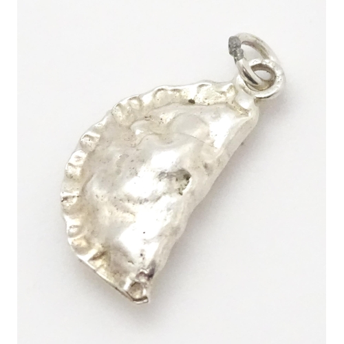 760 - A white metal charm modelled as a Cornish pasty. Approx 1