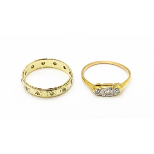 763 - A 9ct gold ring set with white stones together with a gold ring set with diamonds(2)