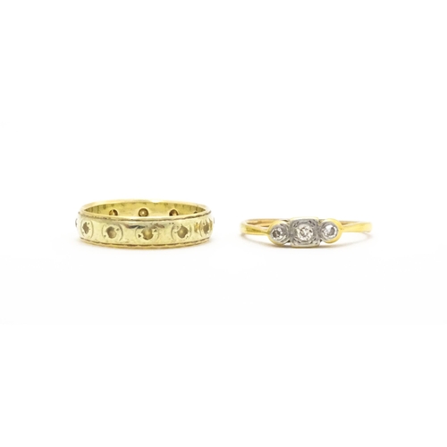 763 - A 9ct gold ring set with white stones together with a gold ring set with diamonds(2)