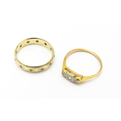 763 - A 9ct gold ring set with white stones together with a gold ring set with diamonds(2)