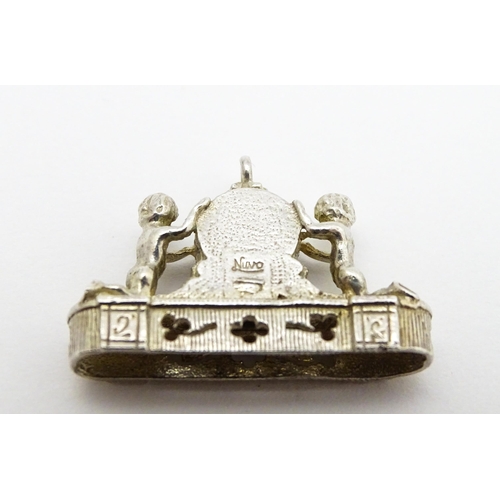 764 - Three novelty pendant charms formed as a crown, solider and clock. The soldier approx 1 1/4