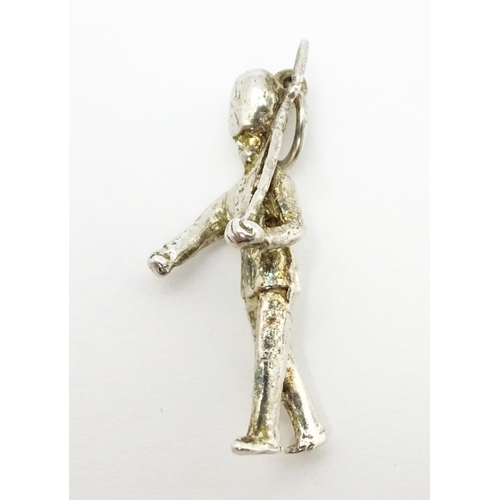 764 - Three novelty pendant charms formed as a crown, solider and clock. The soldier approx 1 1/4