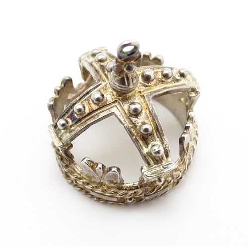 764 - Three novelty pendant charms formed as a crown, solider and clock. The soldier approx 1 1/4