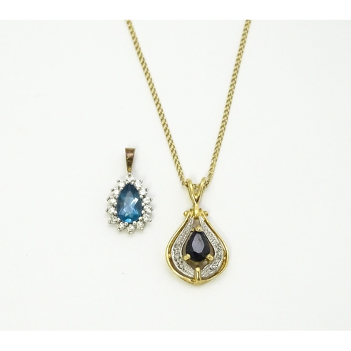 766 - A 9ct gold pendant set with central dark blue stone and chip set diamonds together with a gilt and w... 