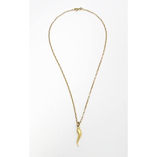 771 - A yellow metal pendant formed as an Italian twisted horn, on a 9ct gold chain. Pendant approx. 1