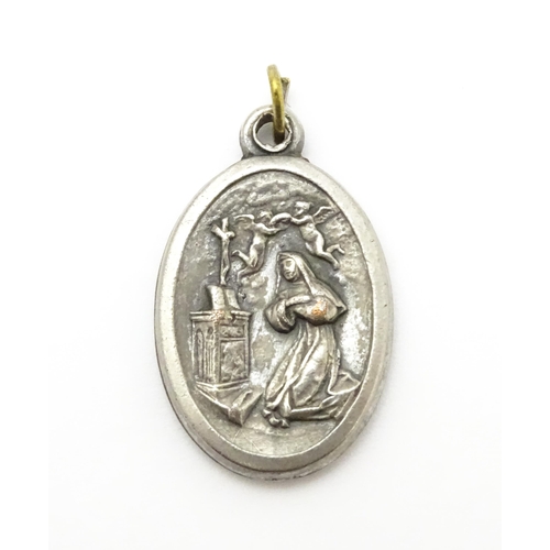 773 - A silver plate pendant of oval form depicting Mary, St Christopher, etc. Approx. 1