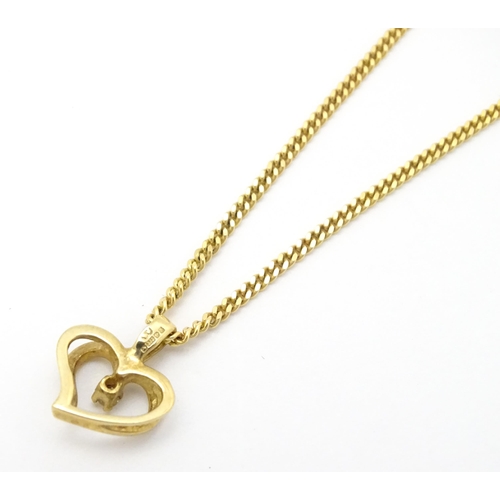 777 - A 9ct gold necklace with 9ct gold pendant of heart form set with central diamond. Chain approx. 18