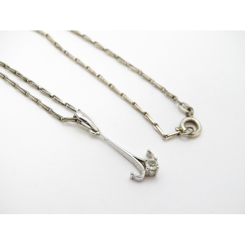 778 - A 9ct white gold pendant set with white stone detail. On a silver chain. Pendant approx. 1