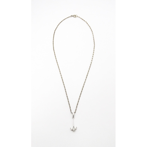 778 - A 9ct white gold pendant set with white stone detail. On a silver chain. Pendant approx. 1