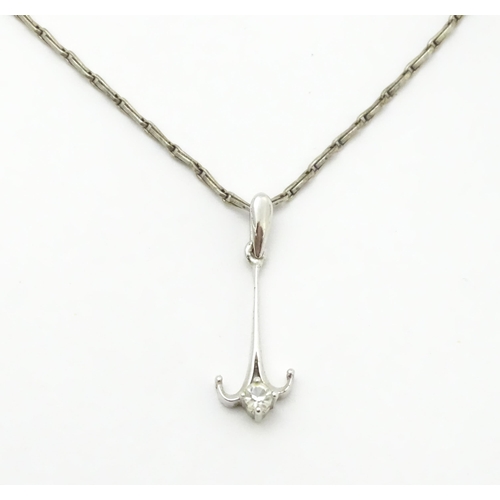 778 - A 9ct white gold pendant set with white stone detail. On a silver chain. Pendant approx. 1