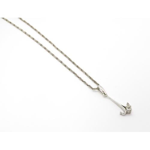 778 - A 9ct white gold pendant set with white stone detail. On a silver chain. Pendant approx. 1