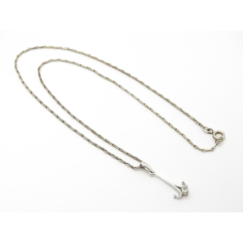 778 - A 9ct white gold pendant set with white stone detail. On a silver chain. Pendant approx. 1